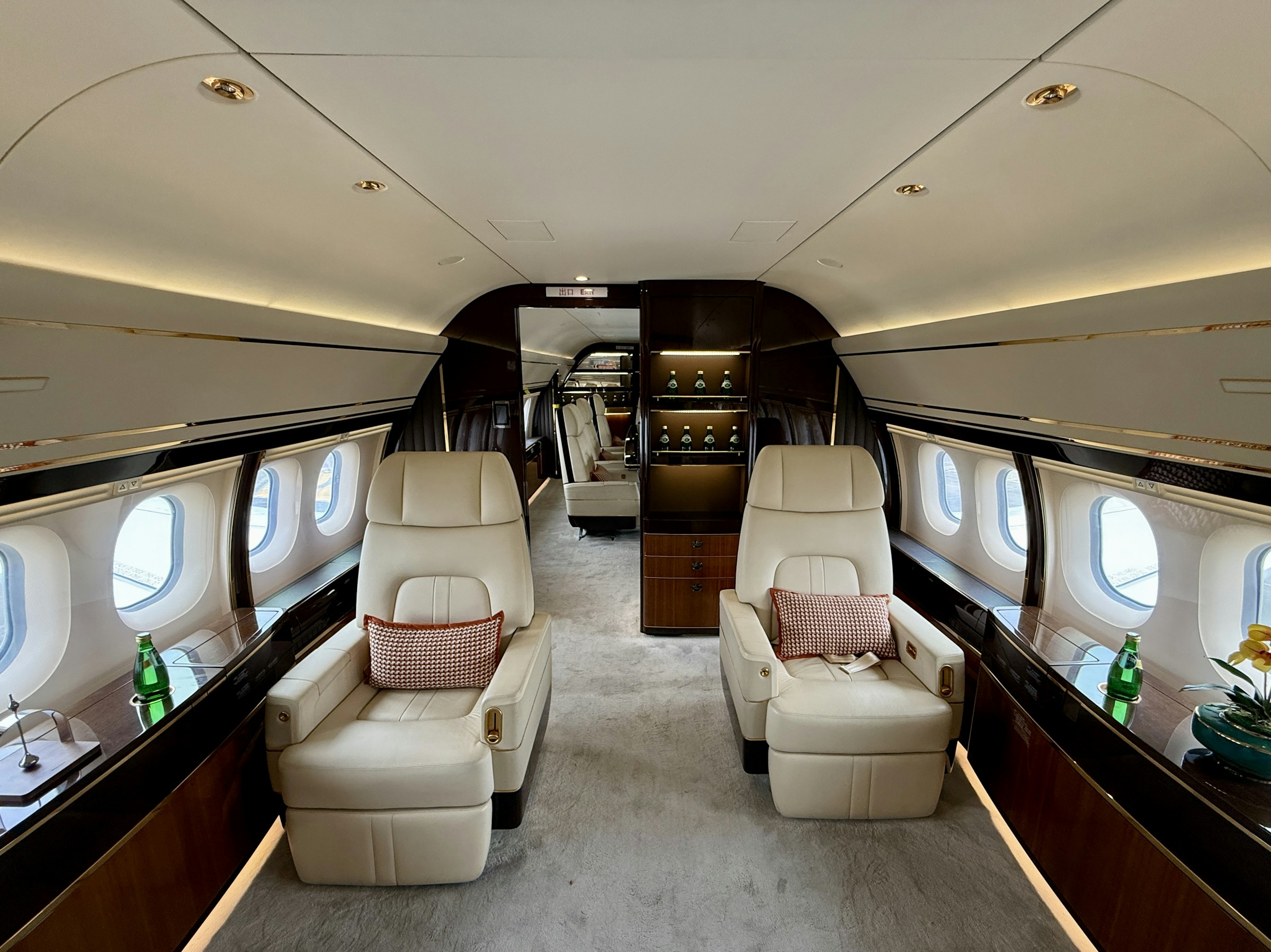 Warmly lit private jet cabin interior